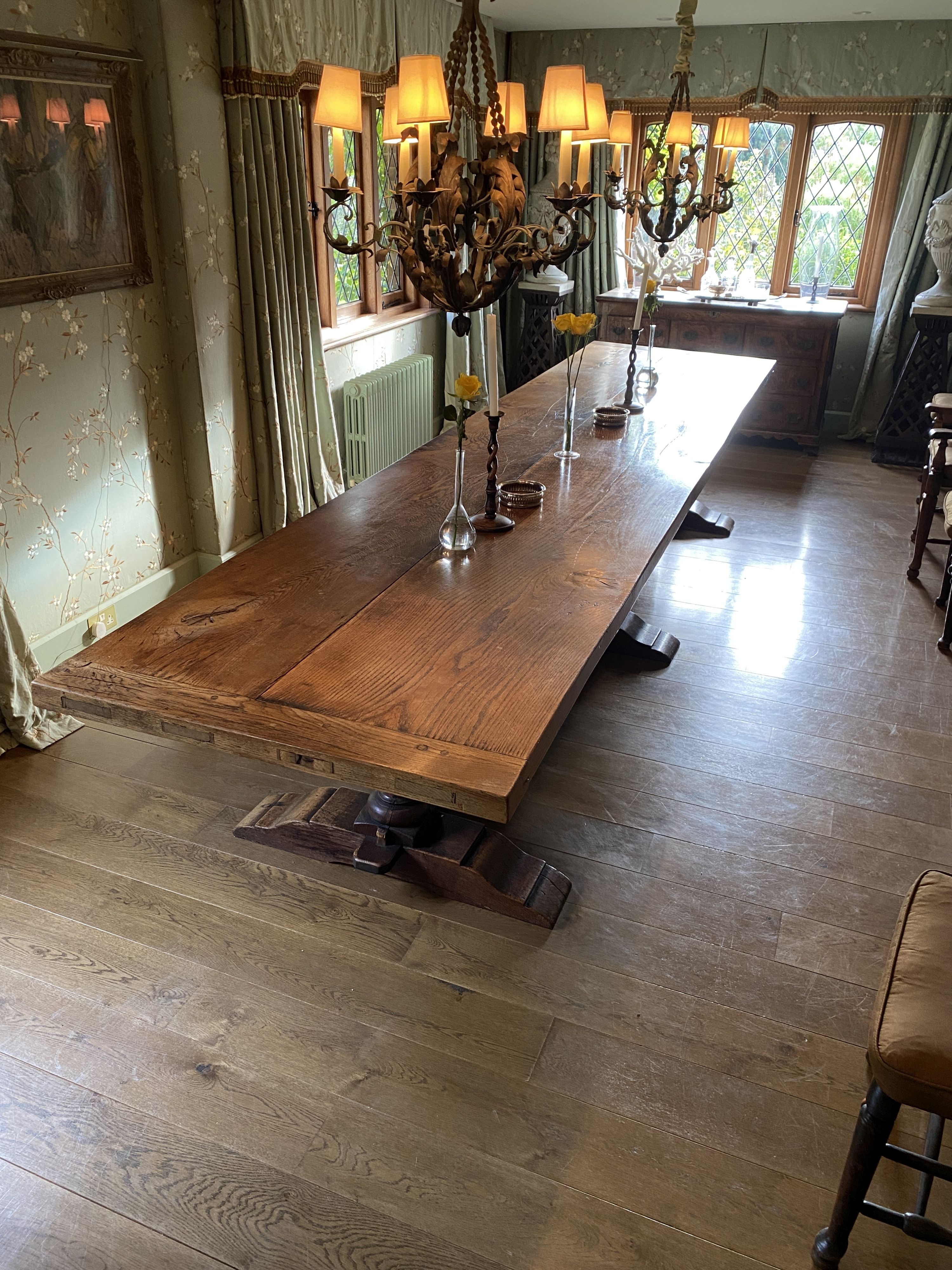 An impressively large 17th century style oak refectory table, with twin plank top on triple baluster supports and trestle foot, width 430cm depth 99cm height 74cm